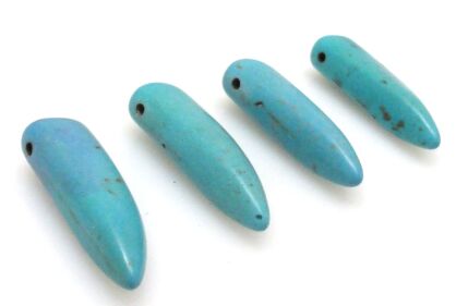 Howlit - kieł 30x10mm - turkusowy - jakość B